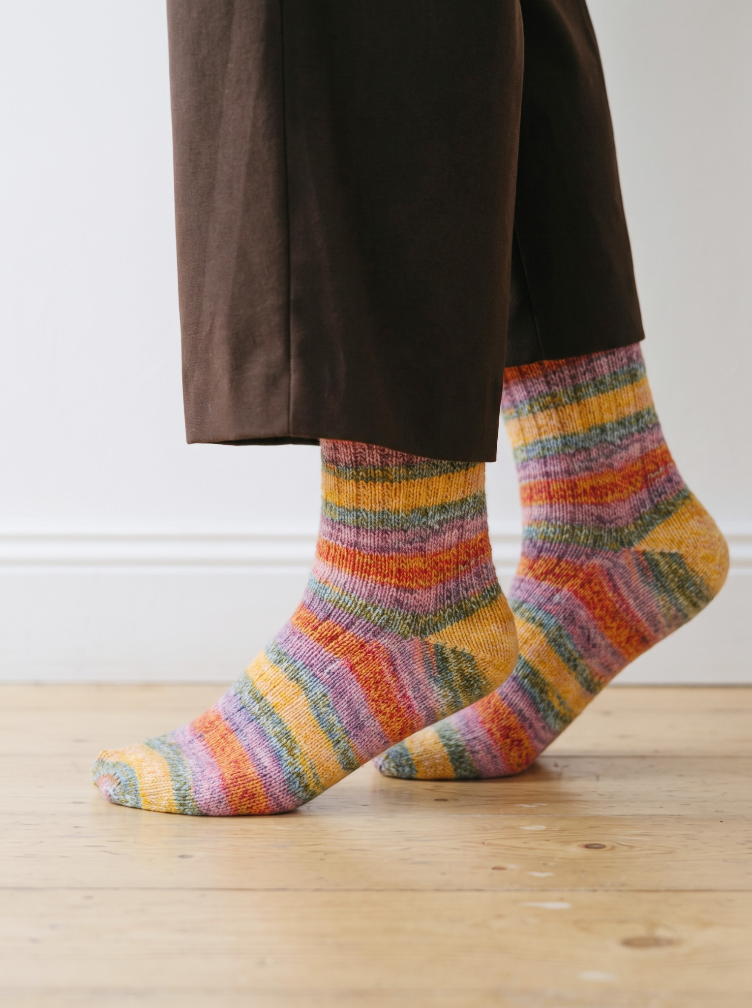 Colourful striped socks in autumn tones